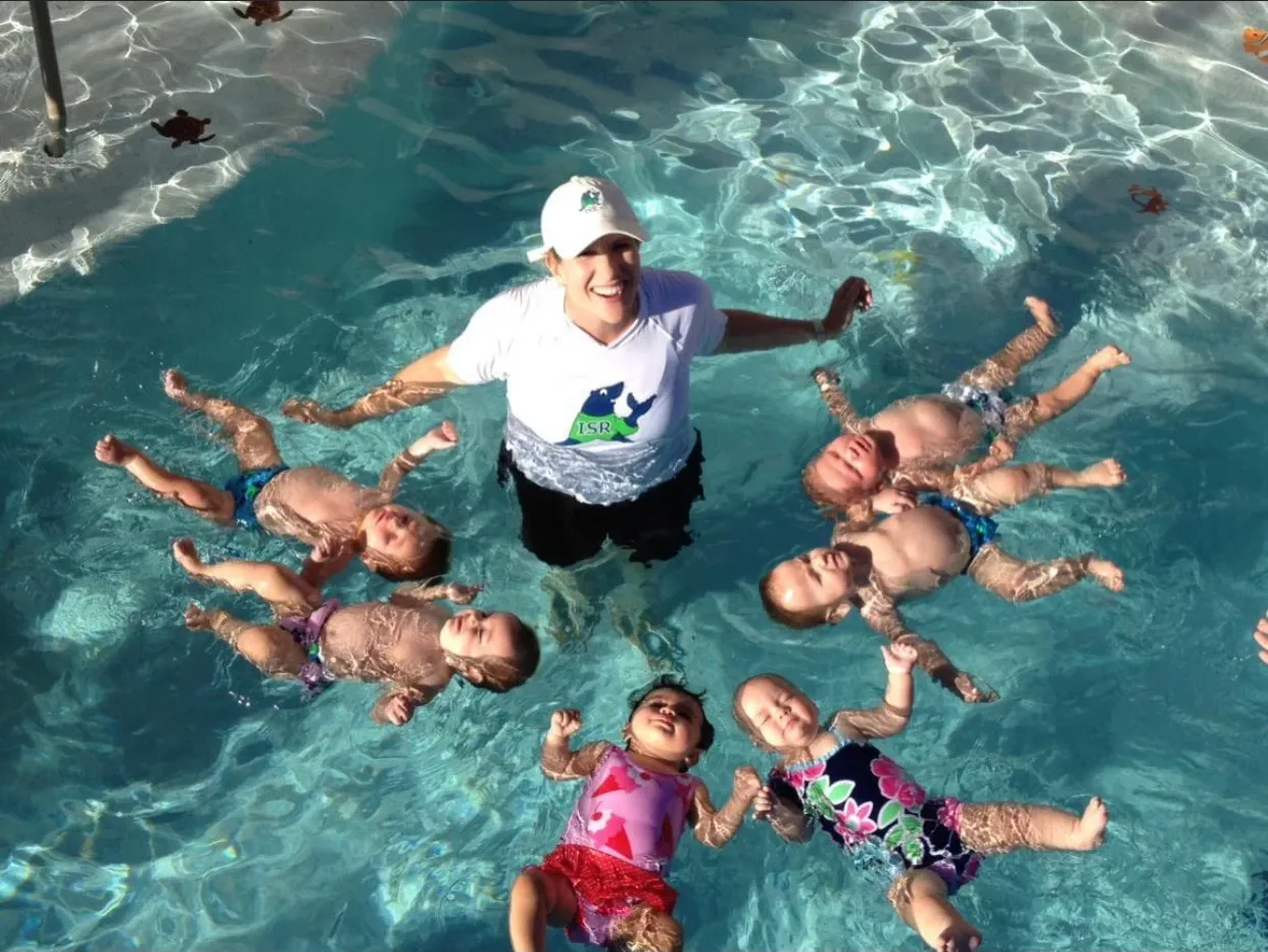 Child learning to swim safely in a pool