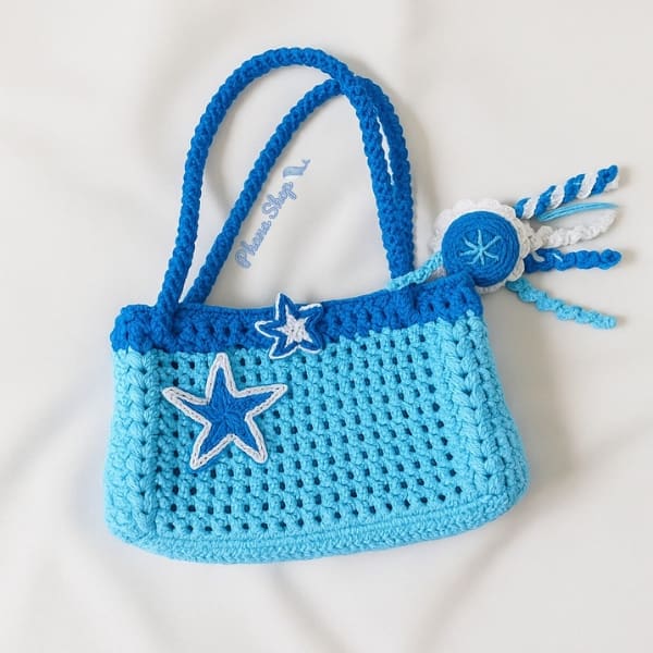 Tas rajut handmade tema laut dengan hiasan ombak dan bintang laut
