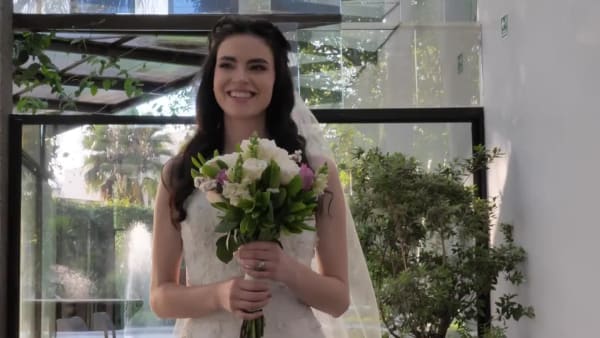 Bride walking with her bouquet