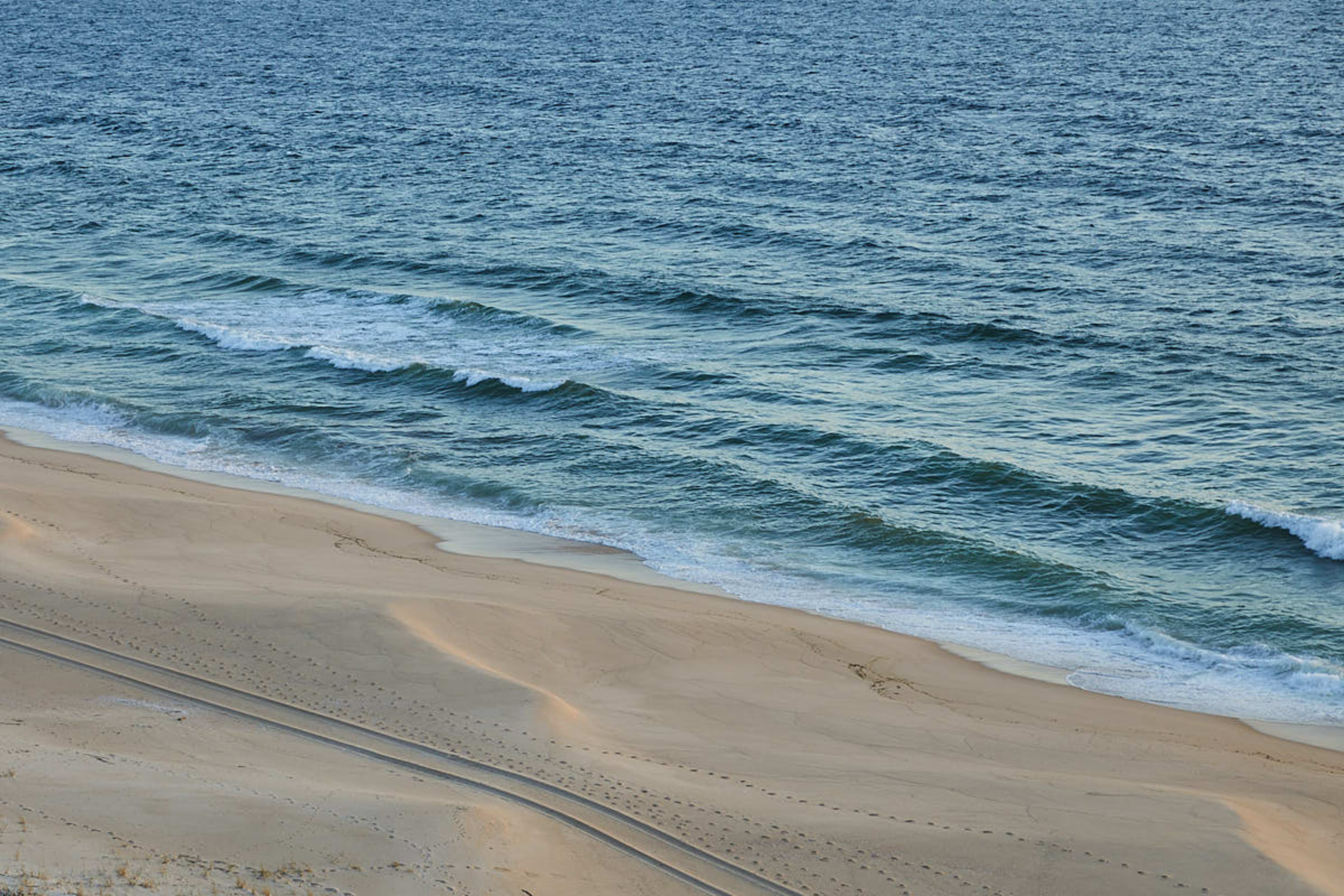 Empty Atlantic beach below the dunes