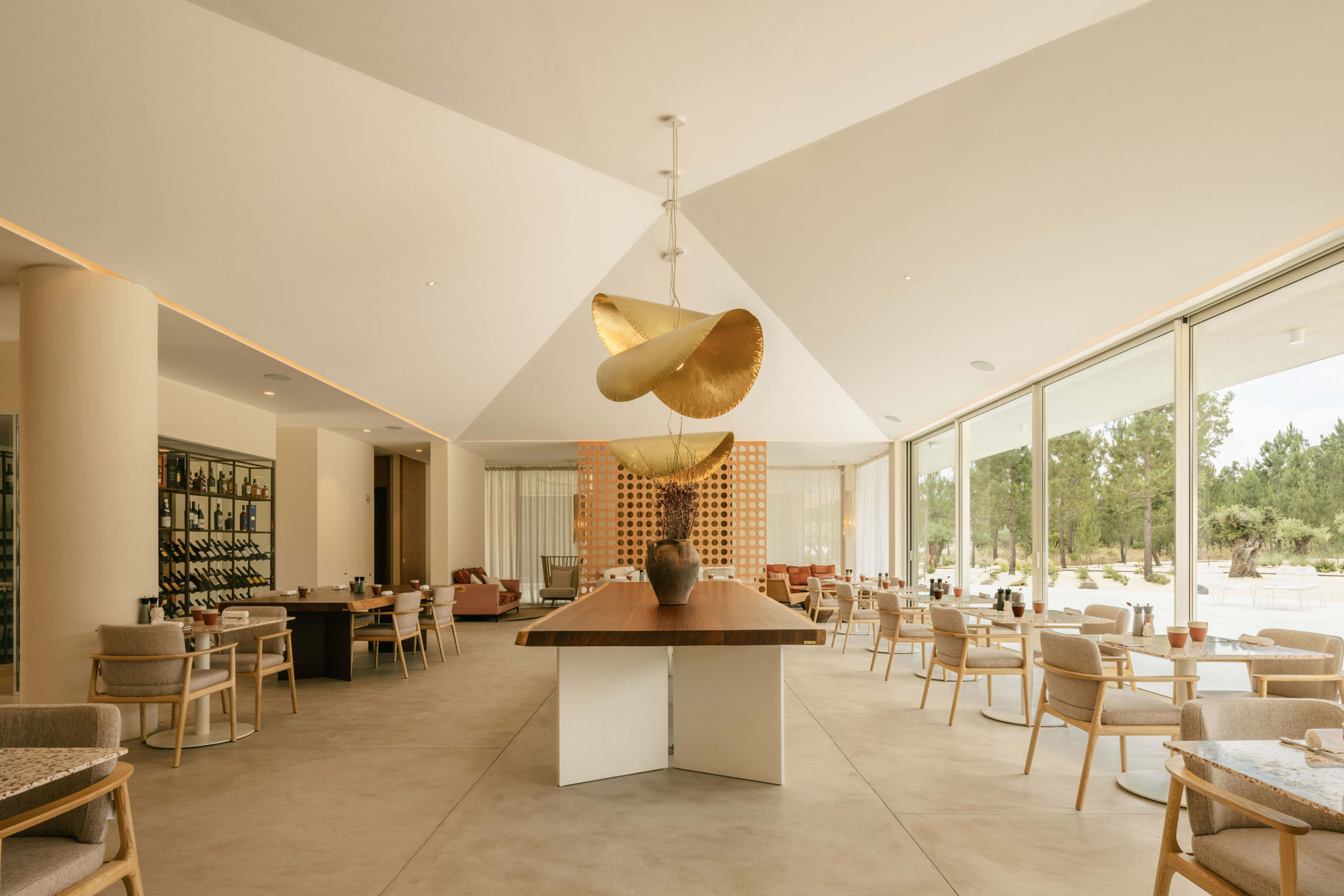The restaurant at dusk, rattan pendants aglow