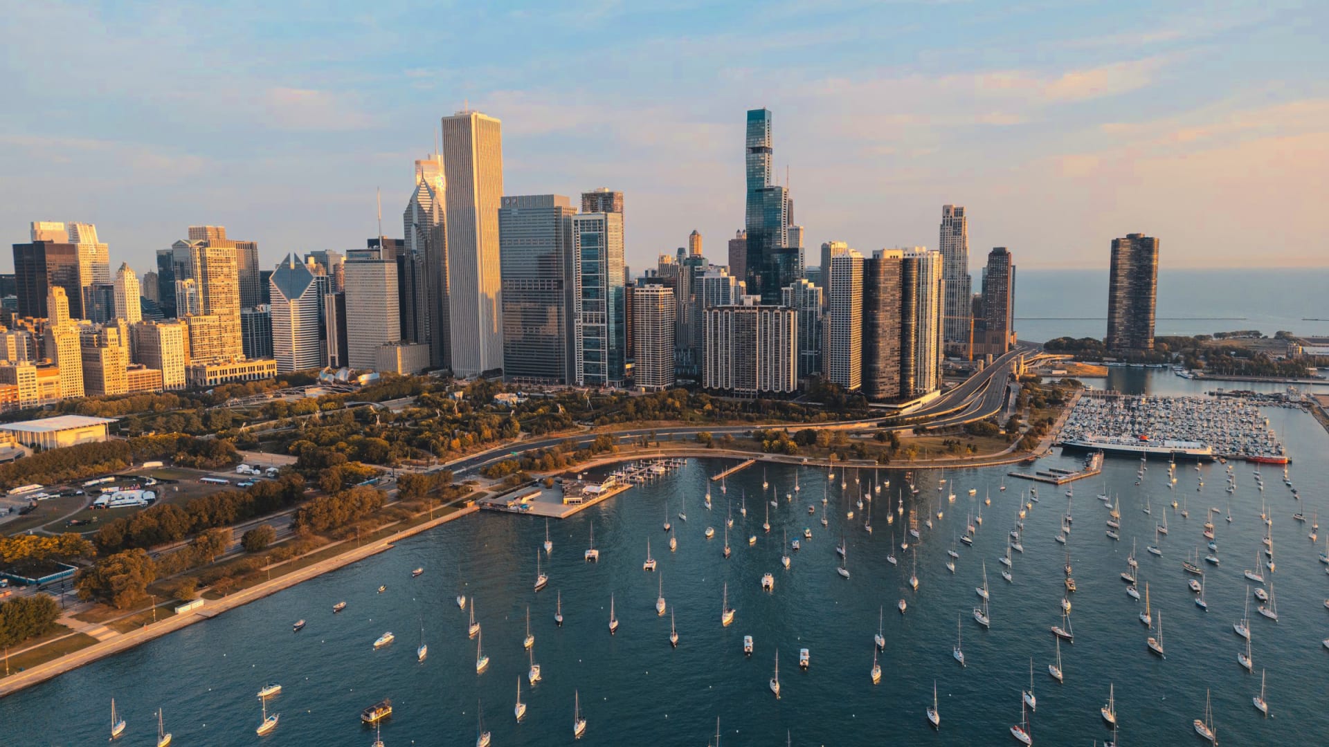 Monroe Harbor from above, its moorings full of sailboats in front of the Chicago skyline