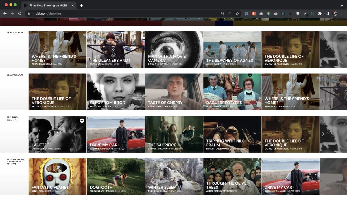 Scrollable page on MUBI streaming service showing sections like 'MUBI TOP 1000', 'Leaving Soon', and 'Trending'. Featured films include international titles like 'Where is the Friend's Home?', 'The Gleaners and I', and 'Drive My Car', represented by their respective posters. The layout emphasizes curated cinematic art from around the world.