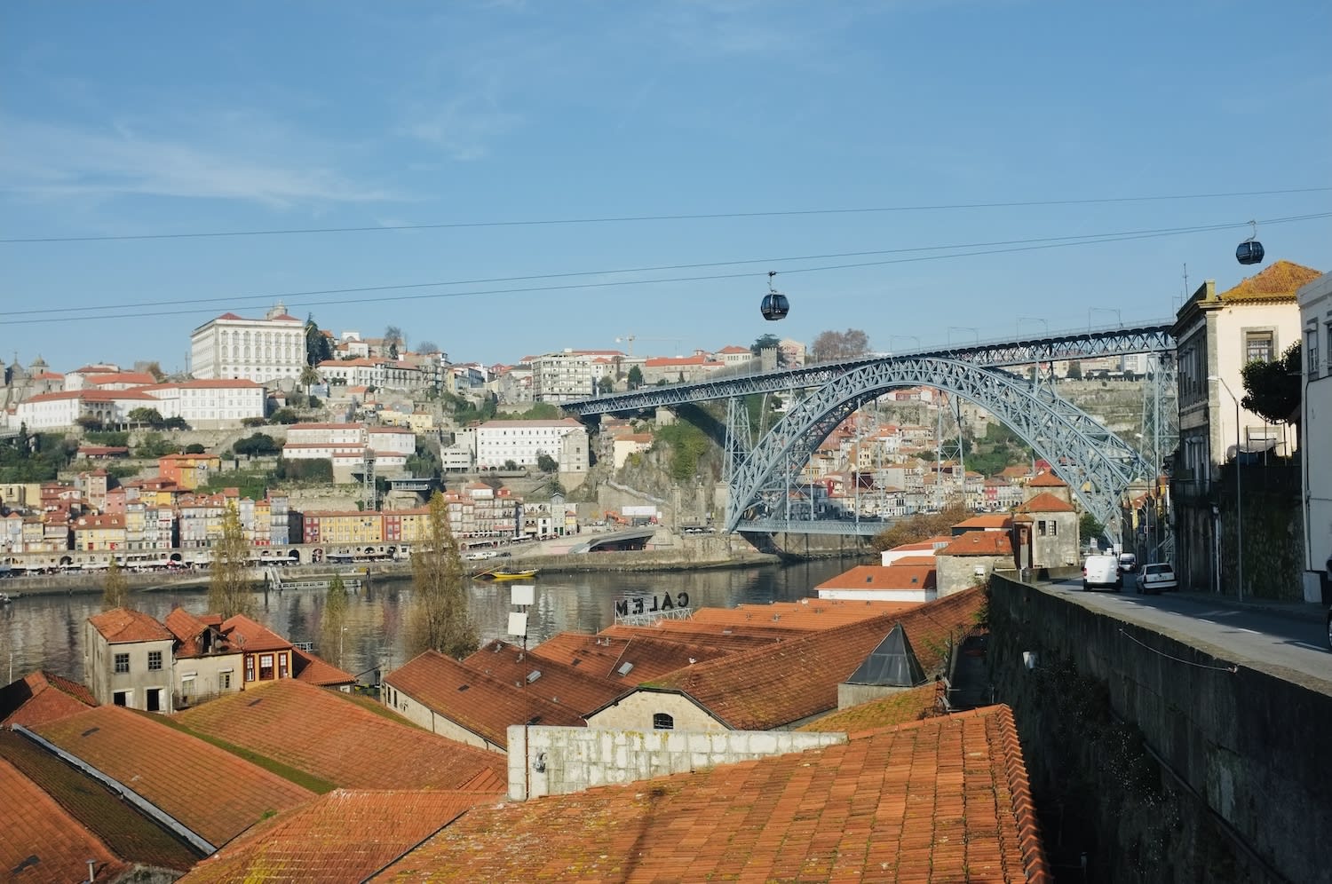 A view of the iconic Ponte Dom Luís I bridge spanning the Douro River, an essential landmark in gay Porto.