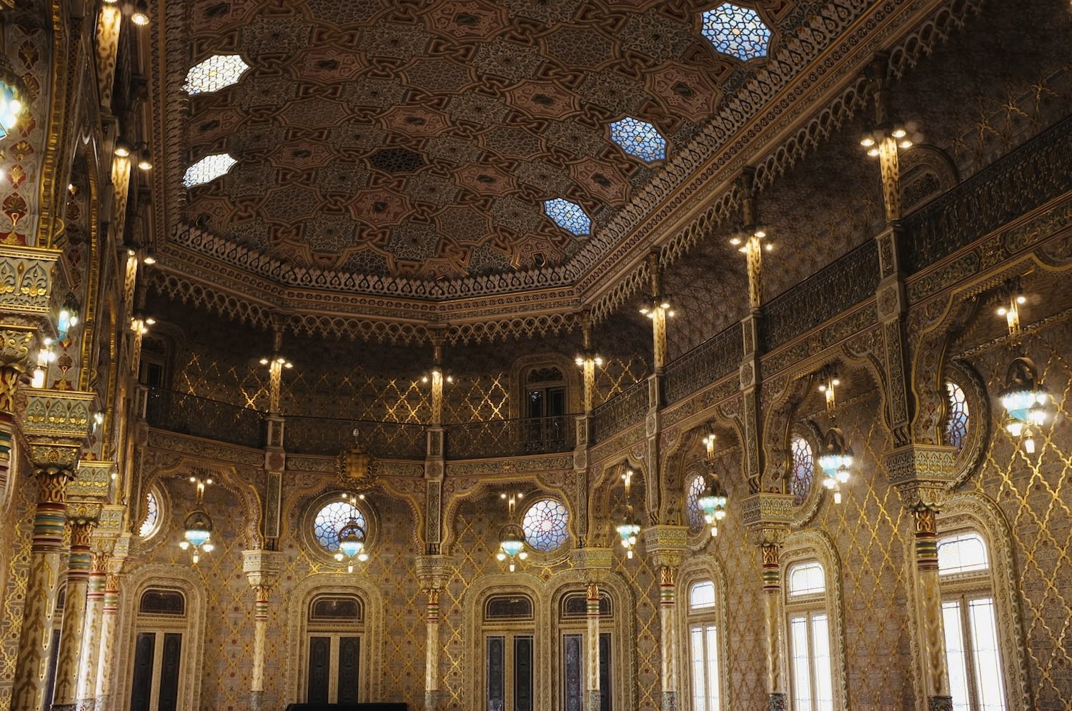 The intricately decorated interior of Bolsa Palace, showcasing the opulent architecture and stunning details that make gay Porto a cultural treasure.