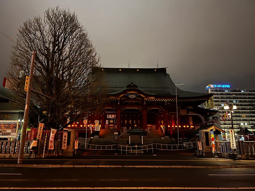 A historic shrine in Sapporo illuminated at night with lanterns, providing a cultural experience on a Hokkaido itinerary.
