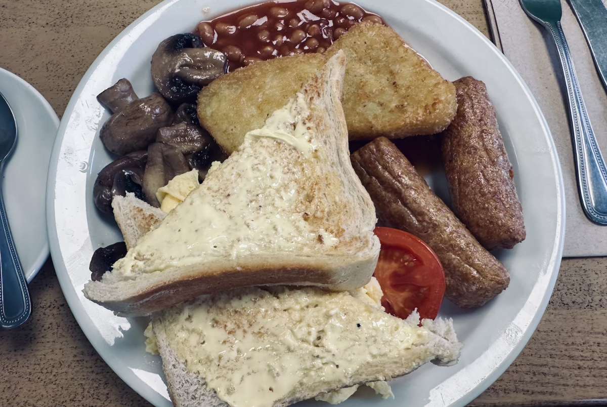 A classic English breakfast served at a local café, a staple of London's hearty cuisine popular in the Gay London community.
