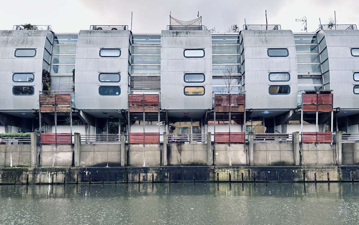 Unique metallic residential architecture along Camden's waterways, showcasing the eclectic and modern living spaces in Gay London.
