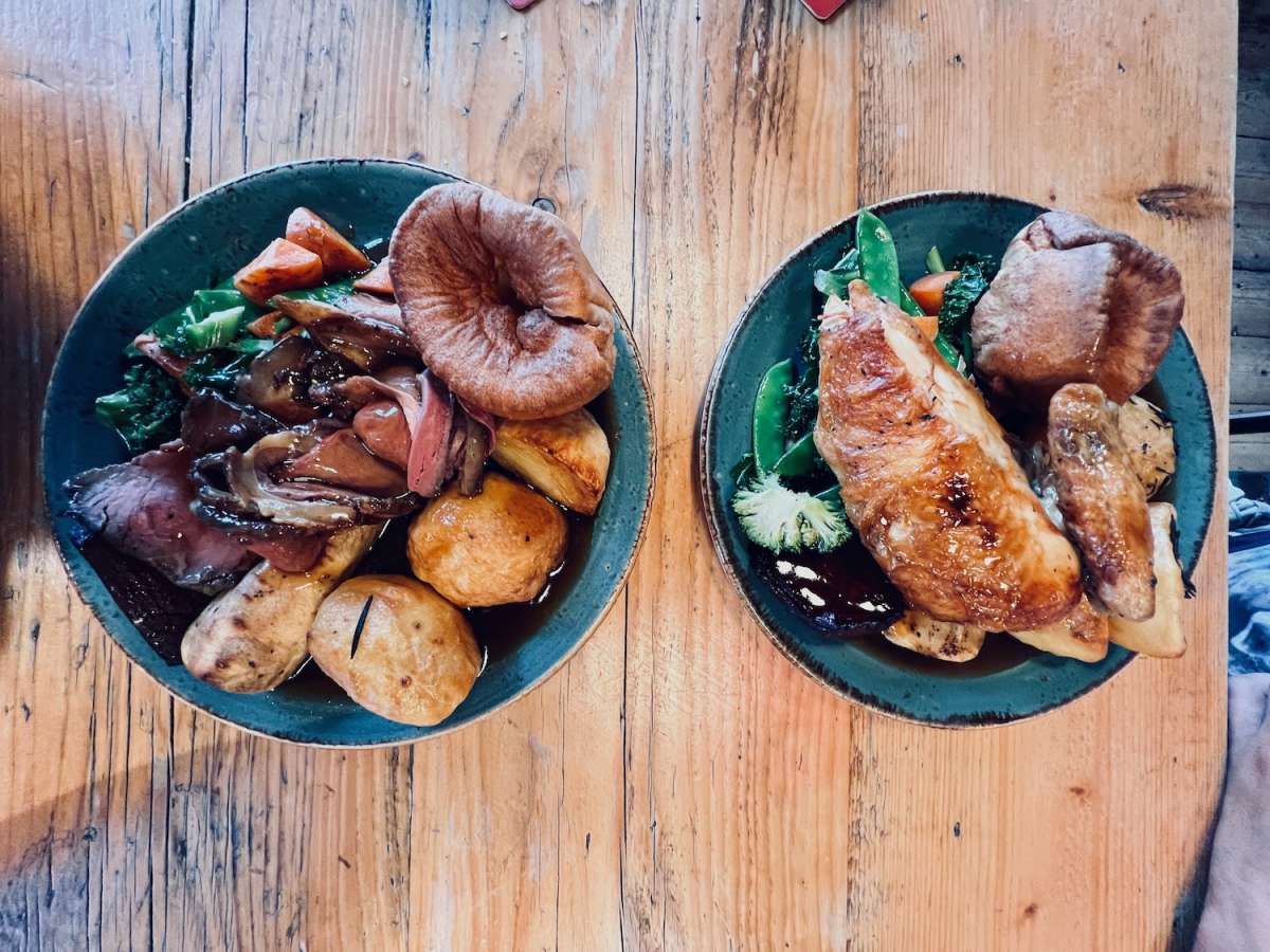 Delicious Sunday roast meals from The Colonel Fawcett in Camden, a local favorite in Gay London's culinary offerings.