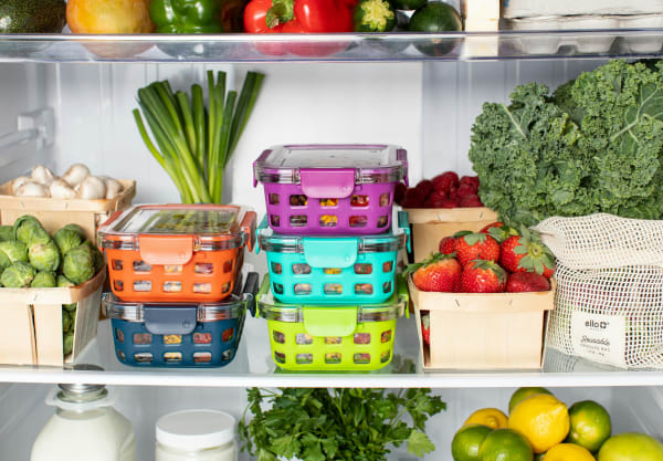 The interior of a fridge, full of fruit and vegetables.