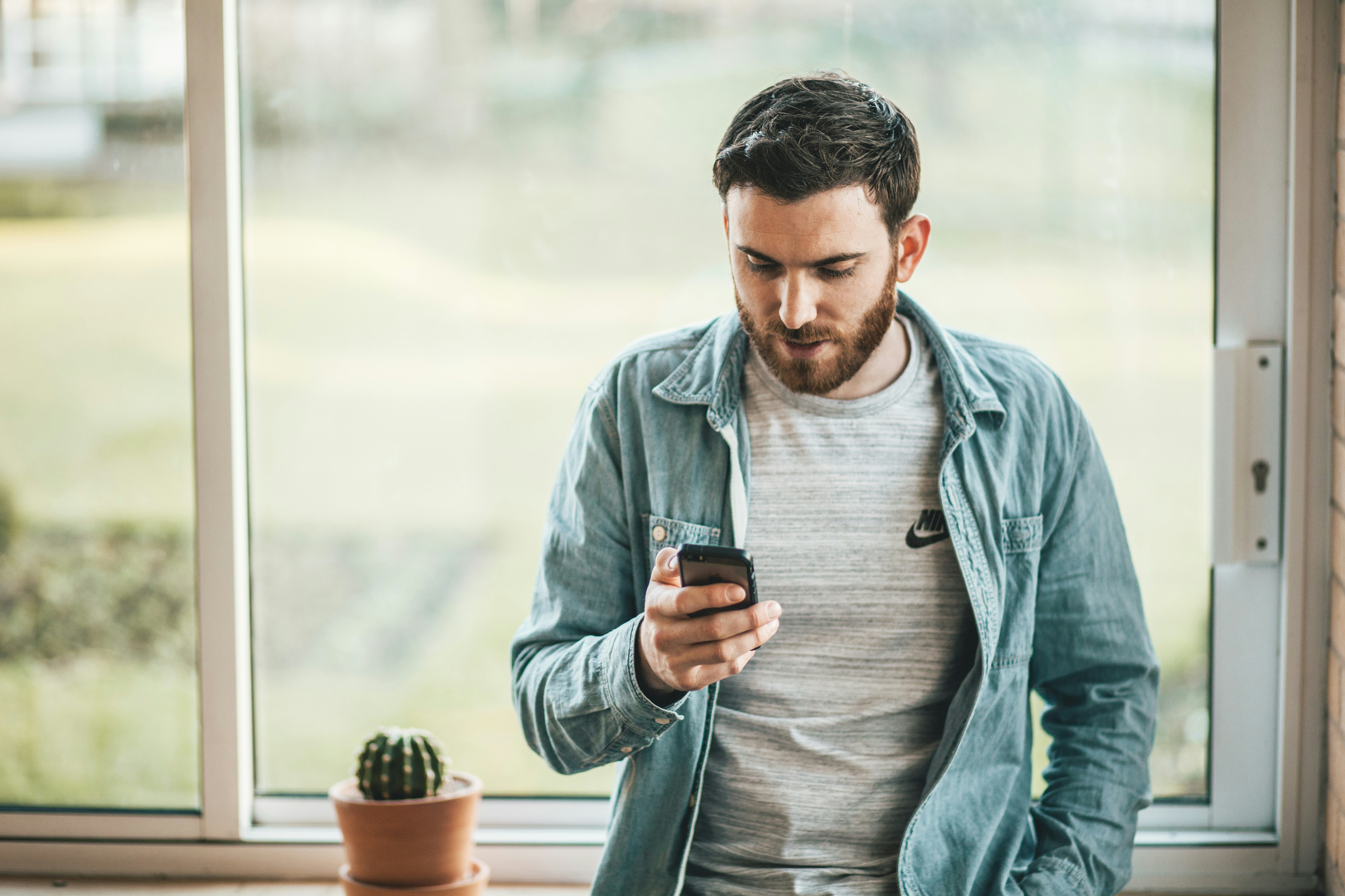 man looking at phone