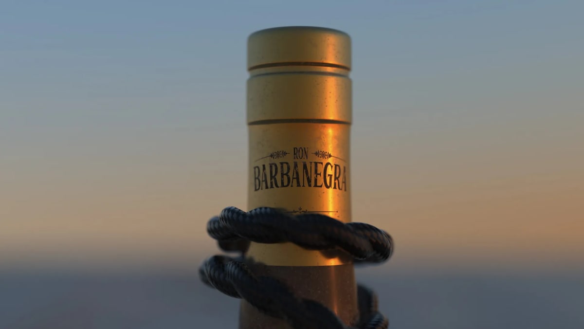 Detalle del tapón dorado del ron pirata Barbanegra con cuerda al atardecer, de Ánder Sánchez, alumno de Diseño Gráfico y Motion Graphics en TRAZOS