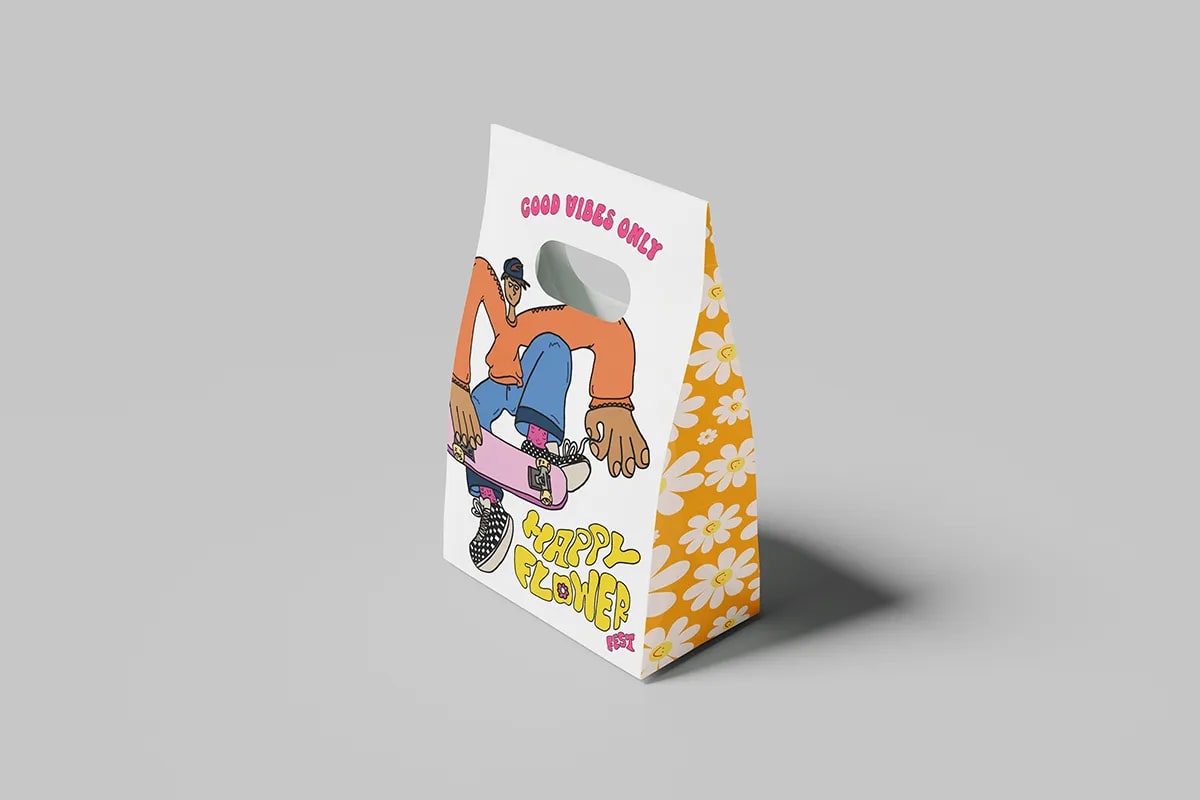 Bolsa de papel Happy Flower Fest con el lema Good vibes only y un skater ilustrado, de Sofía Villalta, alumna de Diseño Gráfico y Motion Graphics en TRAZOS