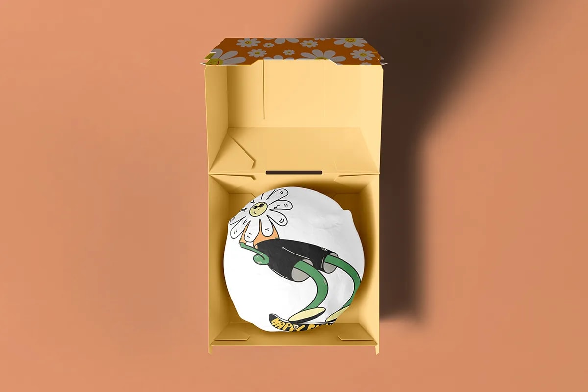 Caja Happy Flower Fest con la tapa estampada de margaritas e ilustración interior, de Sofía Villalta, alumna de Diseño Gráfico y Motion Graphics en TRAZOS