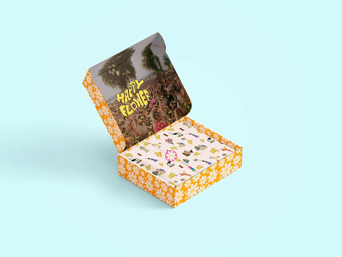 Caja de merchandising Happy Flower Fest abierta con papel ilustrado y estampado de margaritas, de Sofía Villalta, alumna de Diseño Gráfico y Motion Graphics en TRAZOS