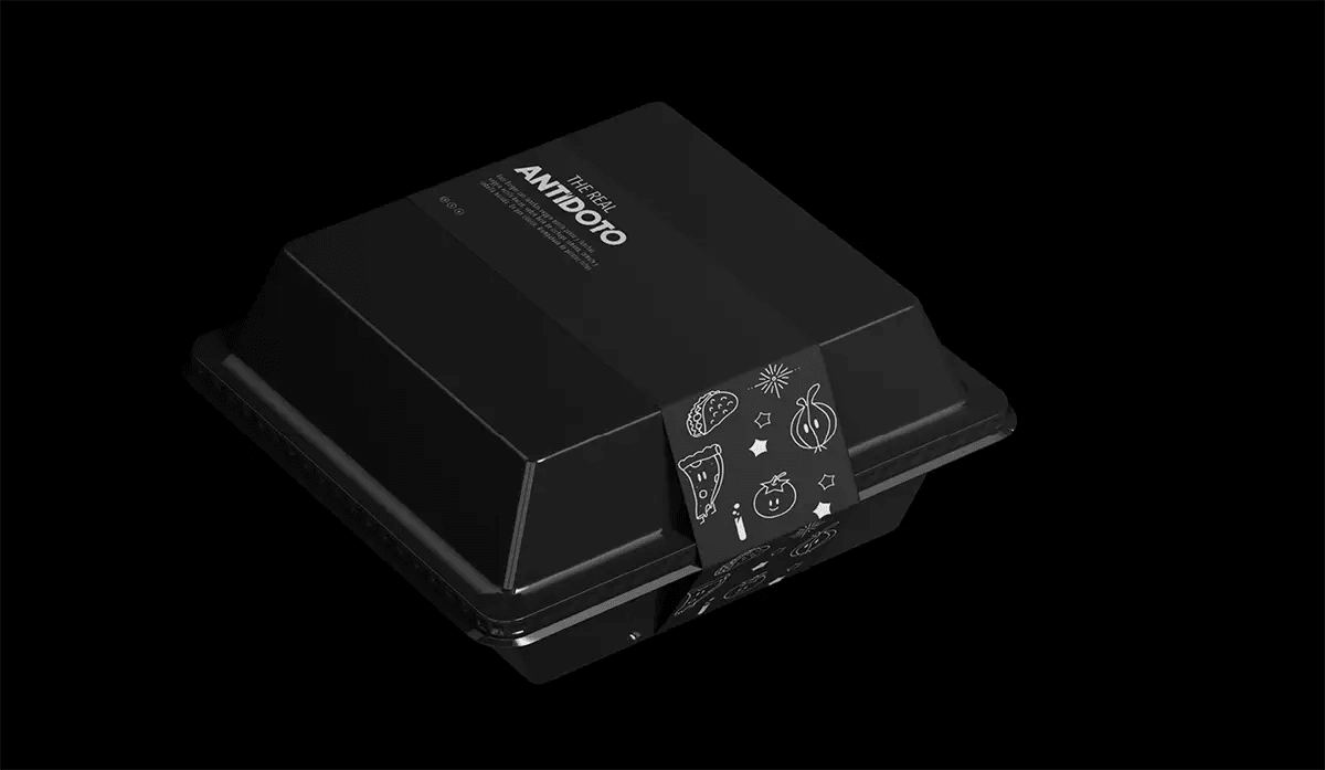 Caja de packaging negra de Antídoto sobre fondo oscuro, de Elena Toledo, alumna de Diseño Gráfico y Motion Graphics en TRAZOS