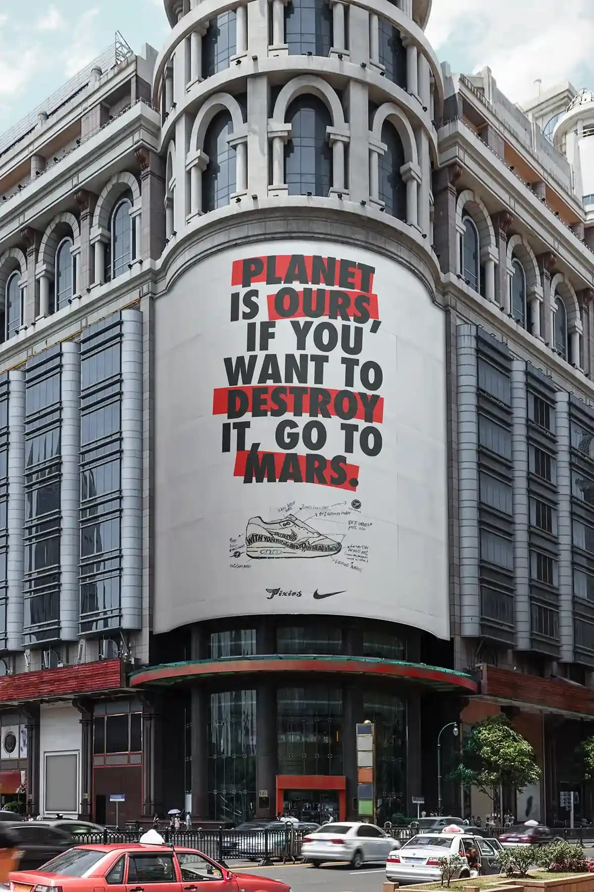 Valla publicitaria en fachada de edificio con texto 'Planet Is Ours If You Want To Destroy It, Go To Mars' Nike x Pixies, de Jaime Herrero, alumno de Diseño Gráfico y Motion Graphics en TRAZOS