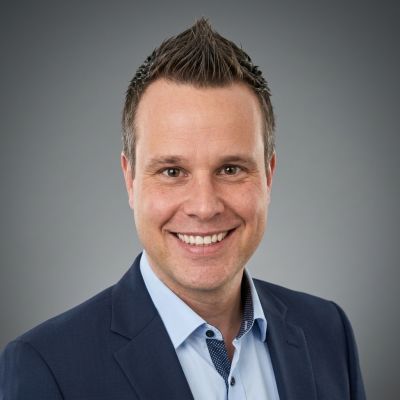 Robert, a health insurance specialist with a friendly smile