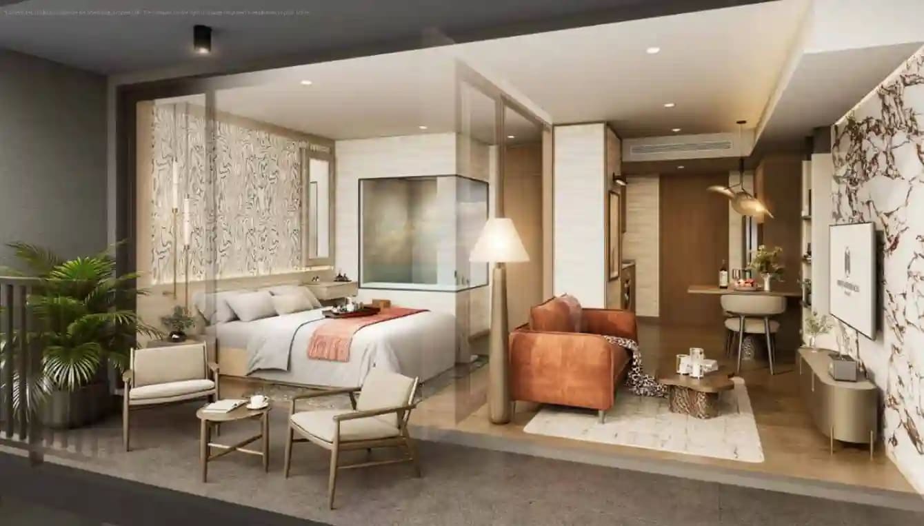 Origin Place Bang Tao — fully furnished studio interior with bedroom, sofa, kitchenette and balcony