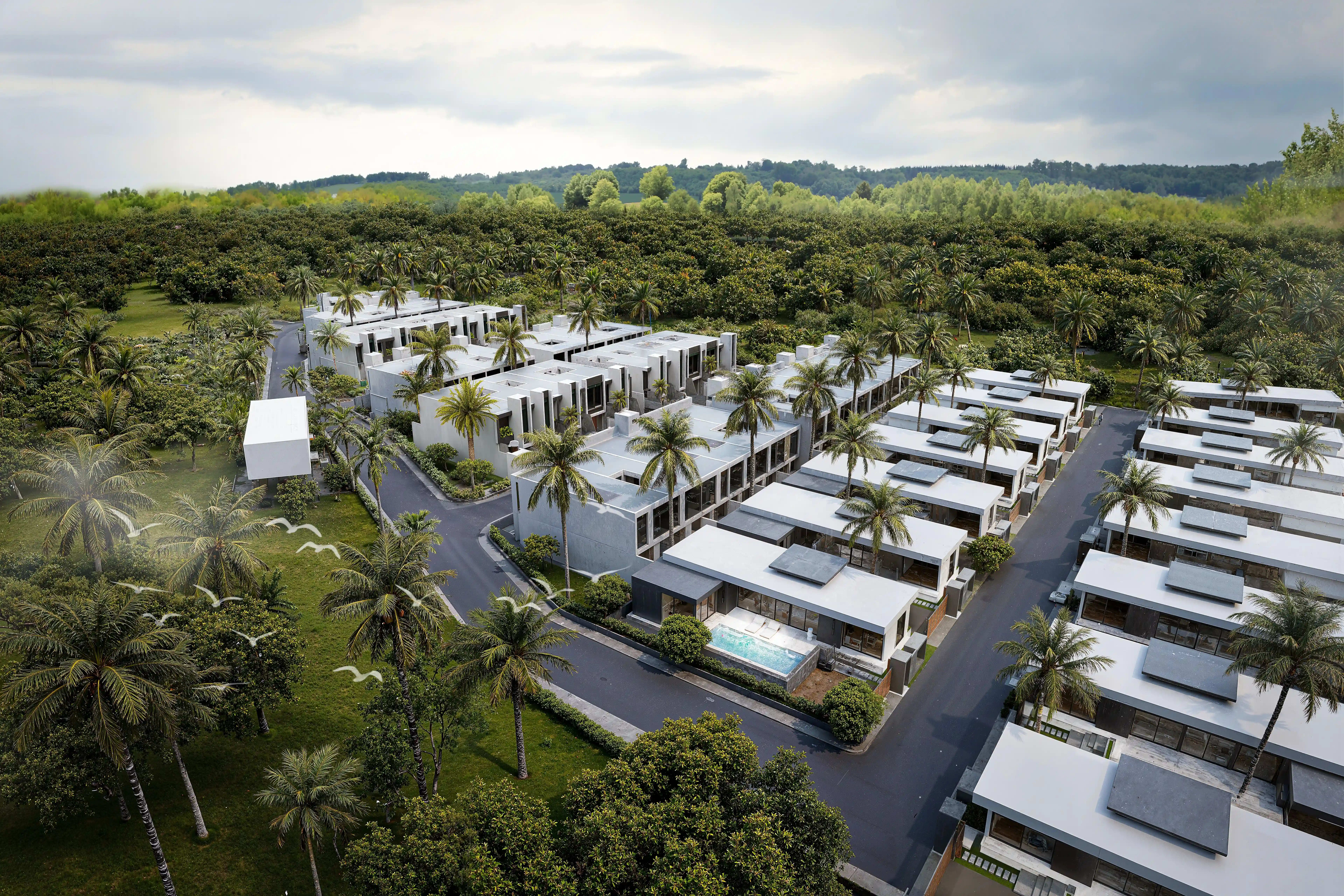 Aileen Residence Lagoon exterior with pool and tropical garden
