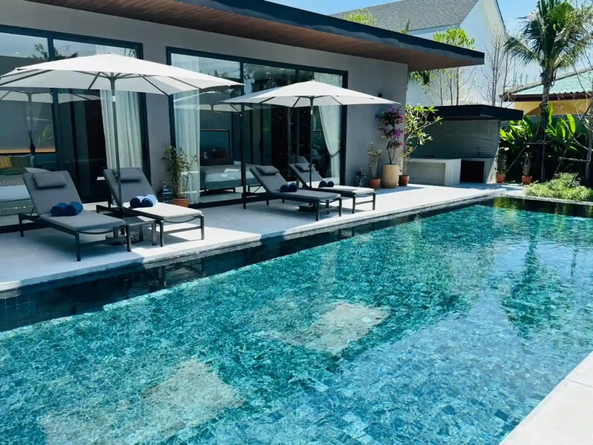 Sea Central villa exterior, completed pool villa with lush landscaping