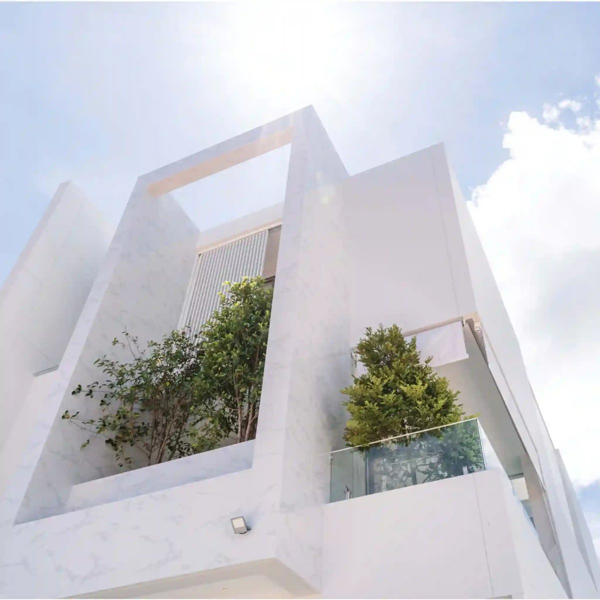 The Residence Prime villa exterior, spacious pool terrace and tropical landscaping in Layan