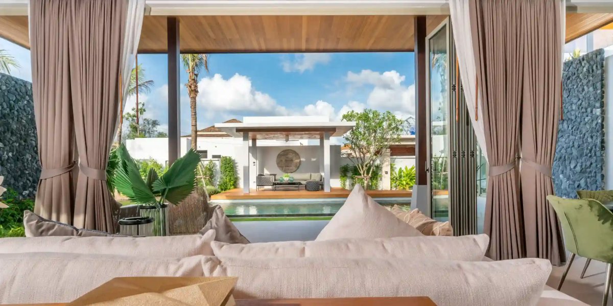 The Residence Prime interior living space, four-bedroom villa with direct pool access from indoor areas