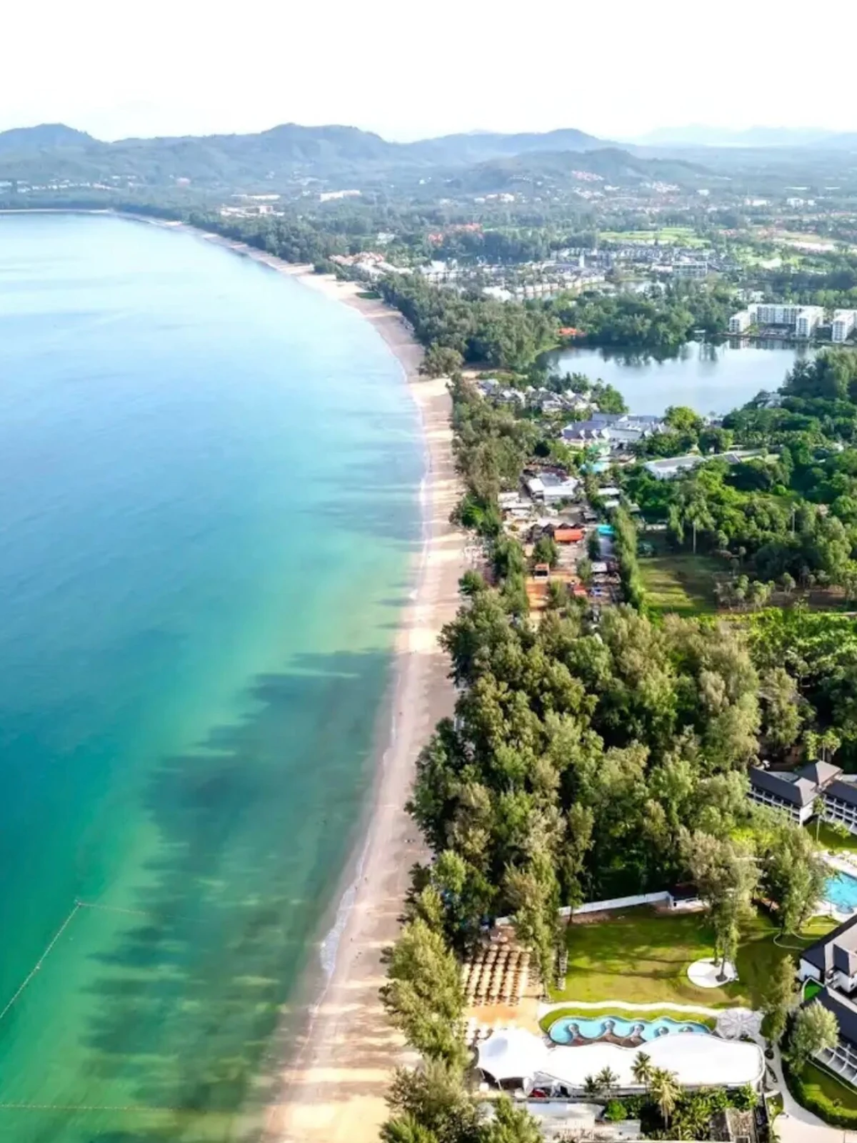Bang Tao beach Phuket — palm-lined bay with turquoise water