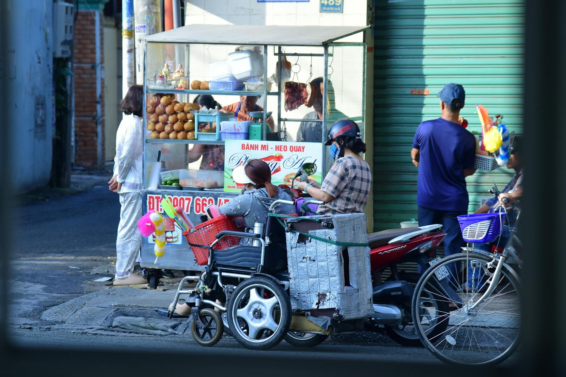 A vibrant snapshot of street food vendors in Vietnam, capturing daily life.