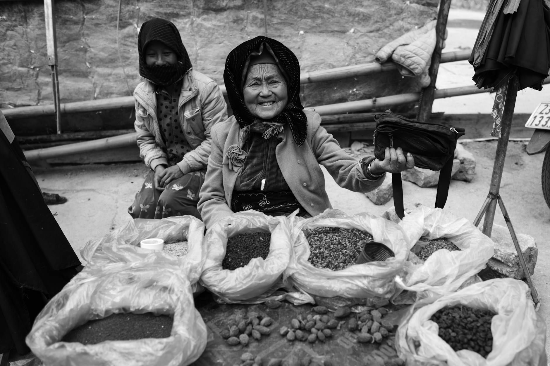 Asian women selling spices at a local market in Hà Giang, Vietnam.