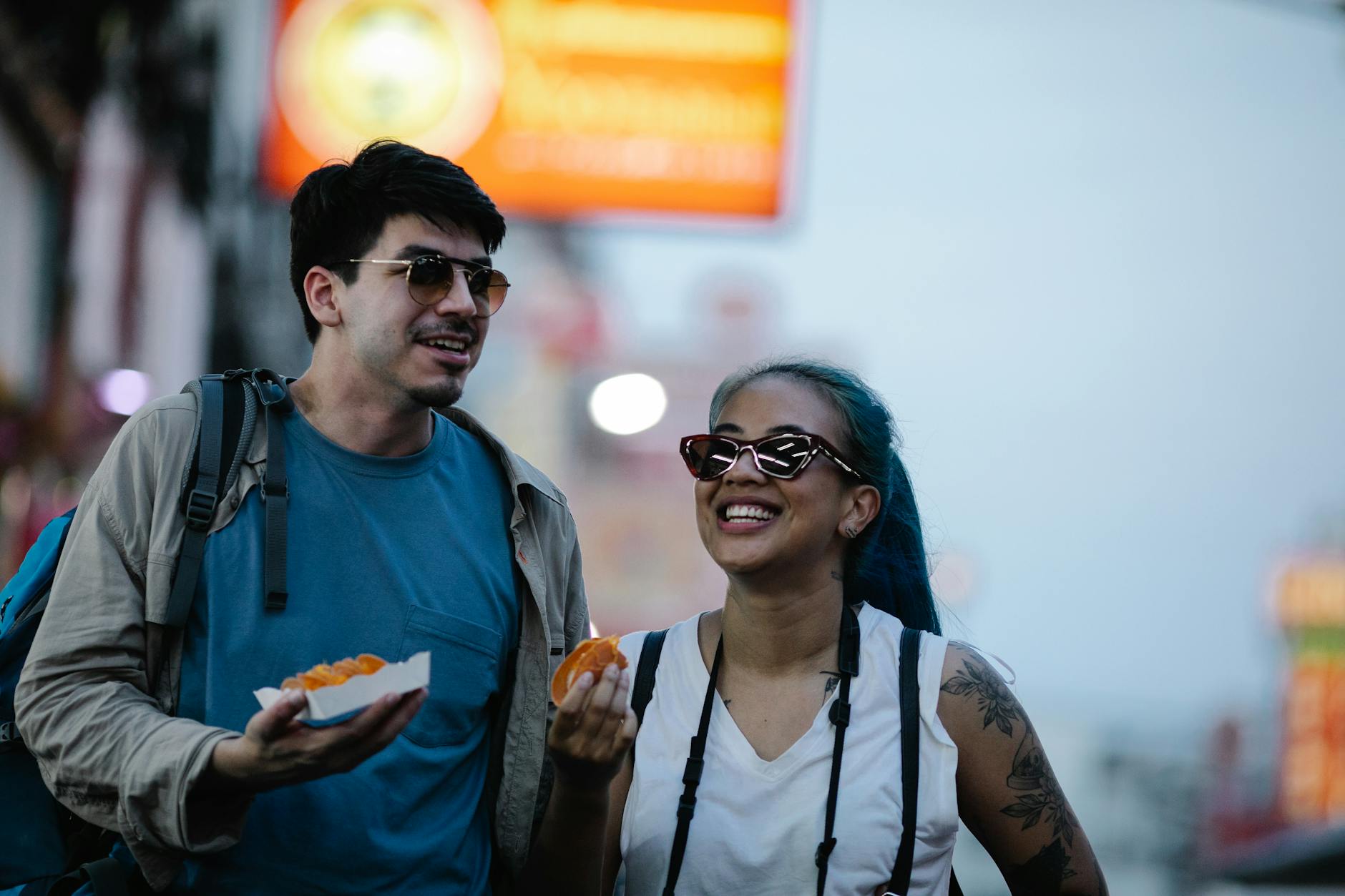 A happy couple enjoying street food together, capturing moments of joy and exploration.
