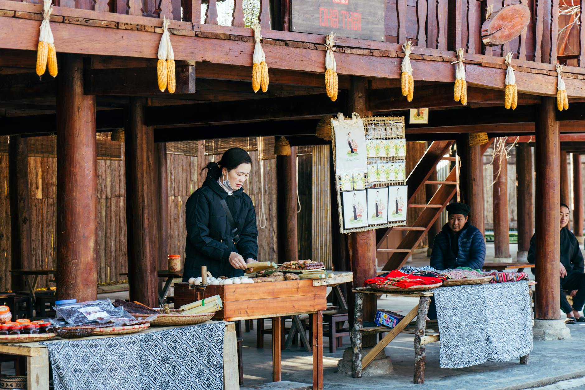 Explore the vibrant local market scene in Lao Cai with traditional crafts and textiles on display.