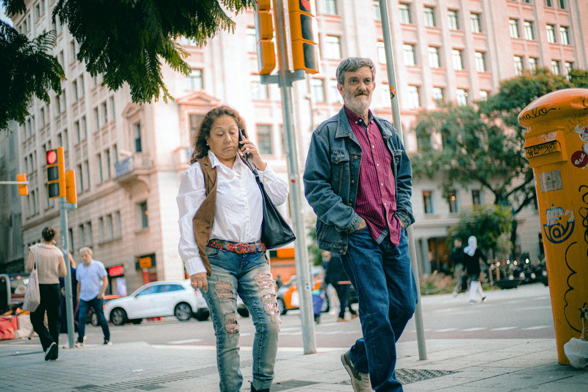 Casual street scene with people walking in an urban city environment.