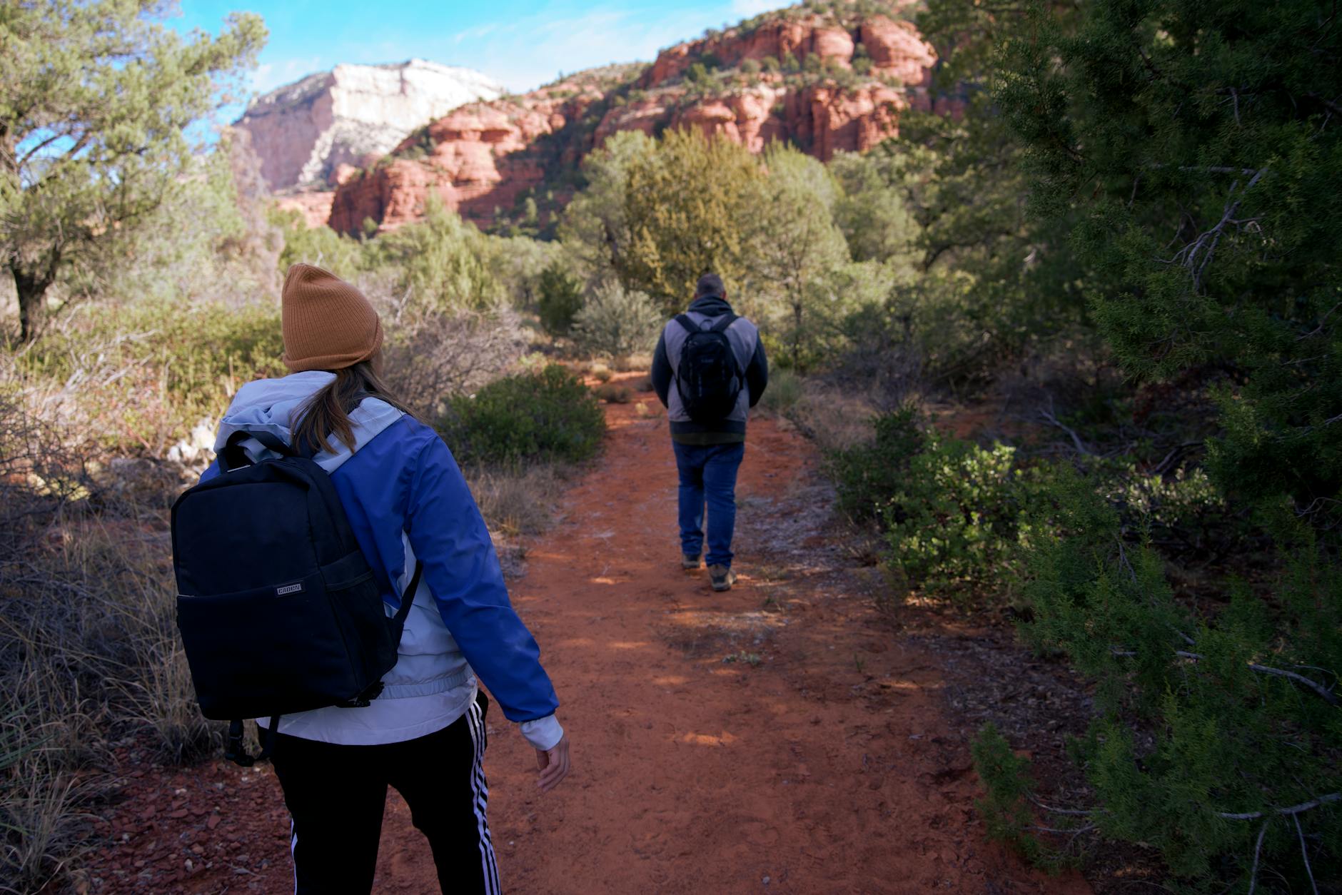 Backpackers explore the stunning red rock trails of Sedona, Arizona.