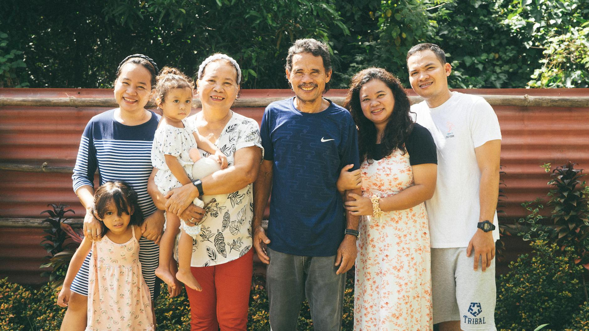 Joyful family enjoying outdoor time together in the garden.