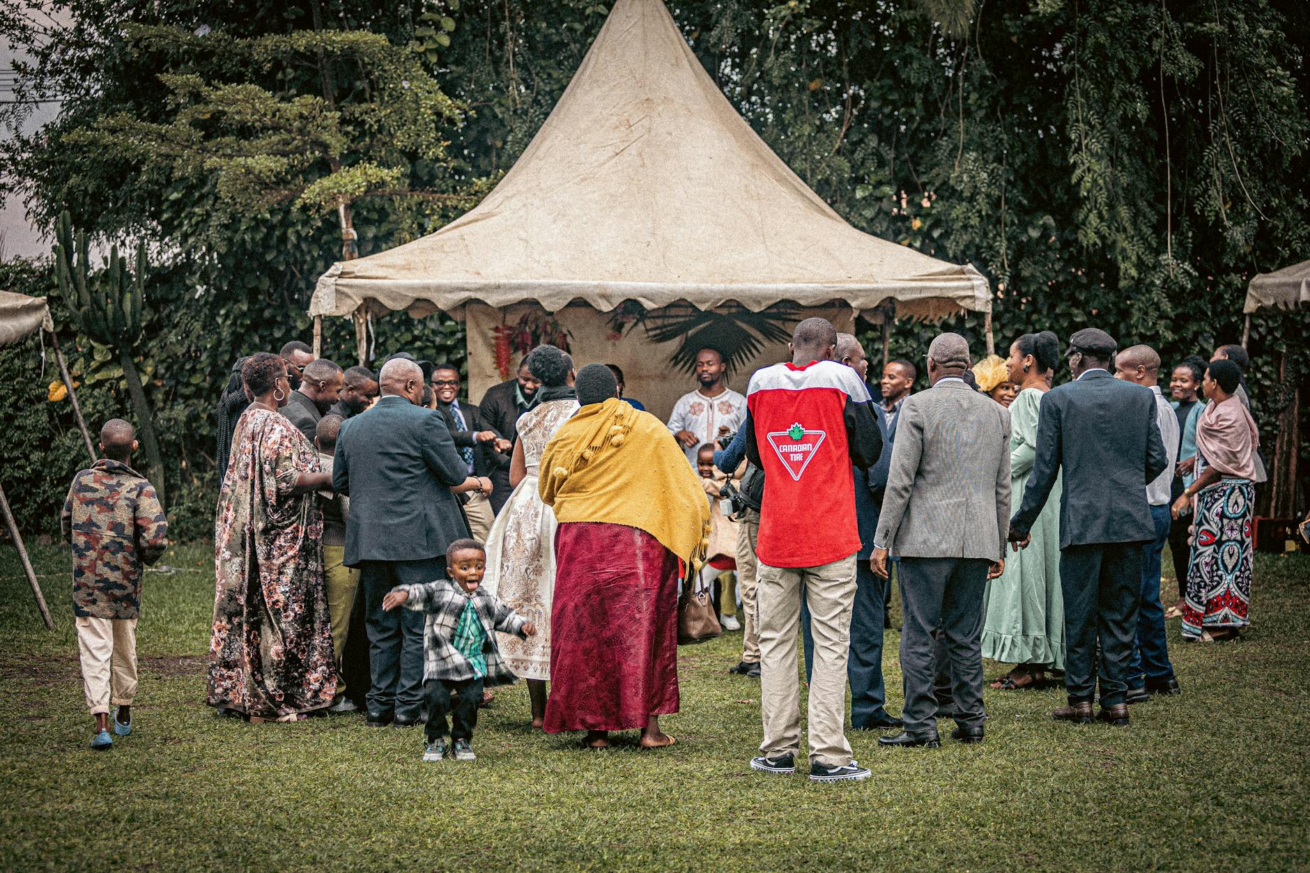 Joyful outdoor family event with diverse group celebrating together.