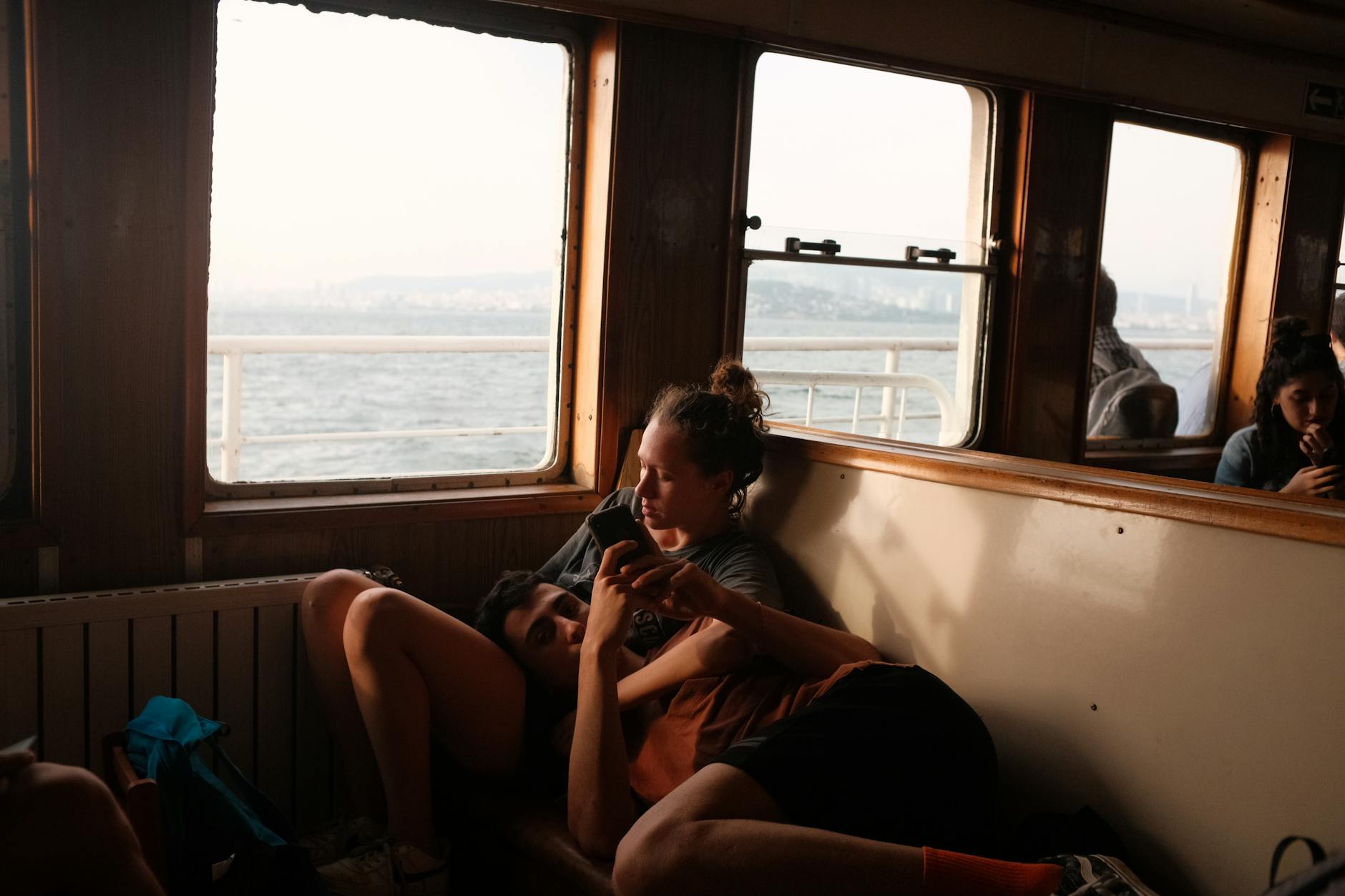 A serene moment of a couple enjoying a ferry ride in İstanbul, Turkey during the day.