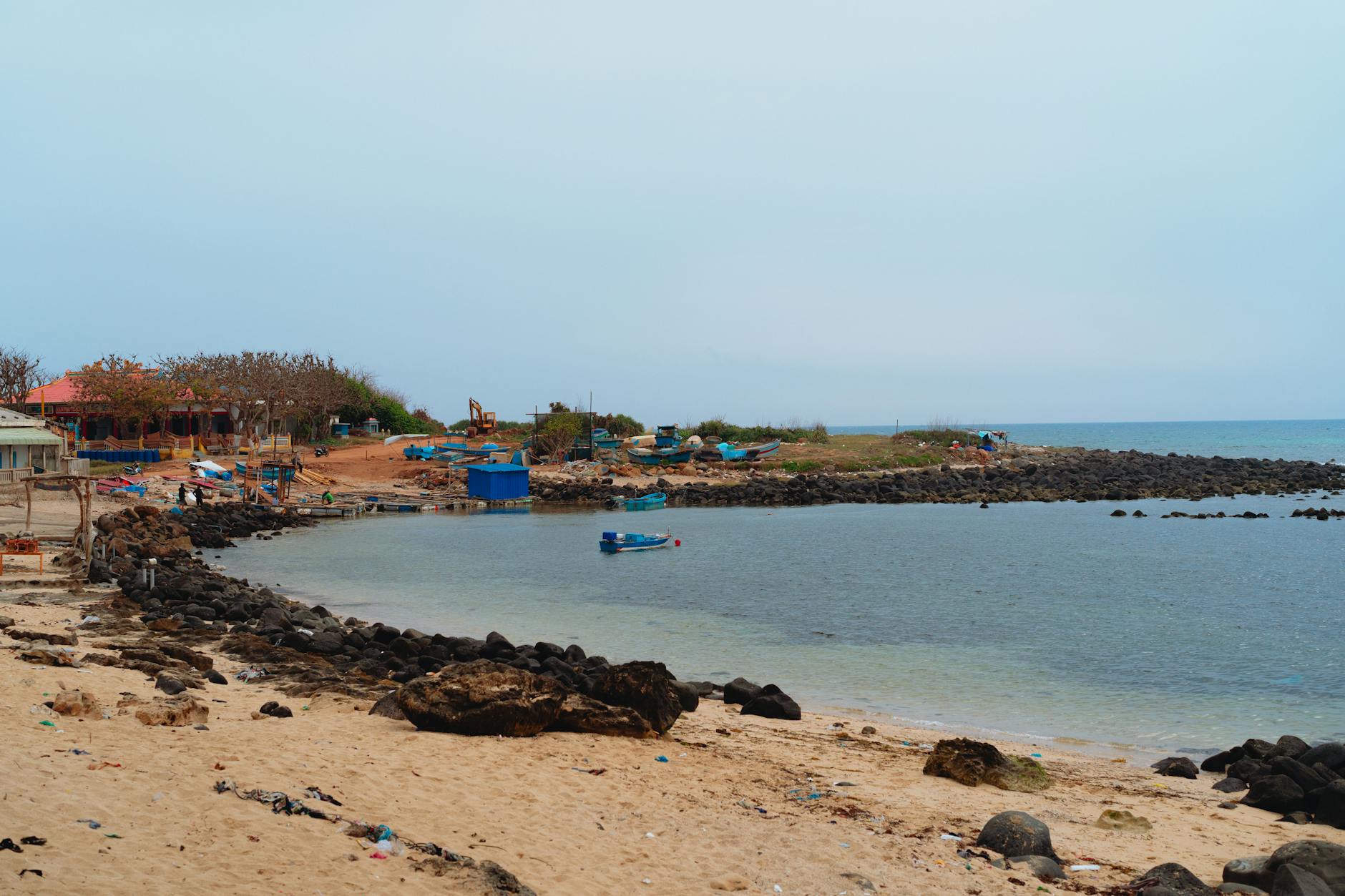 Explore the tranquil beach at Bình Thuận, Vietnam with calm waters and scenic views.