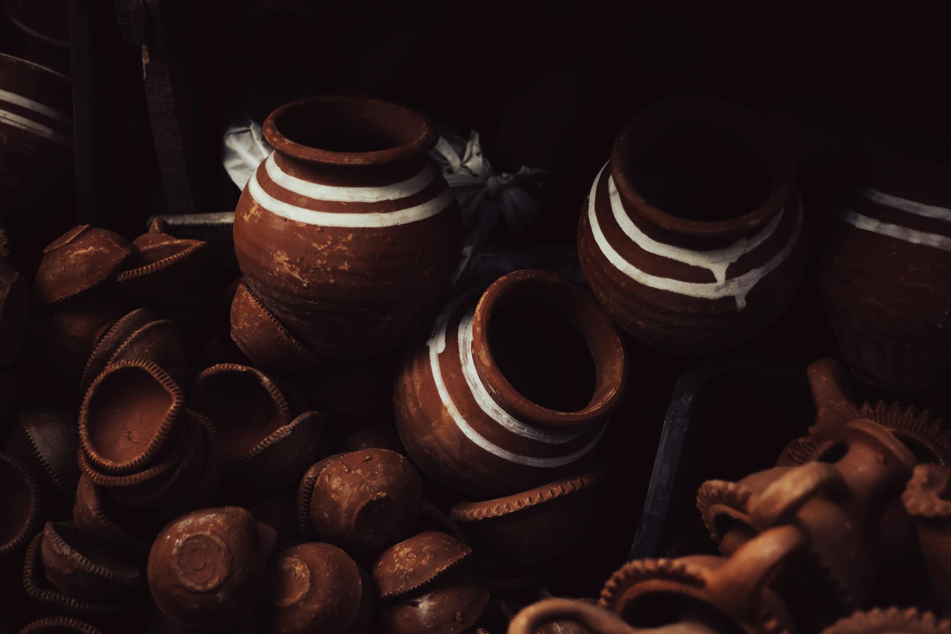 A collection of handcrafted Indian clay pots, showcasing traditional design and earthy tones.