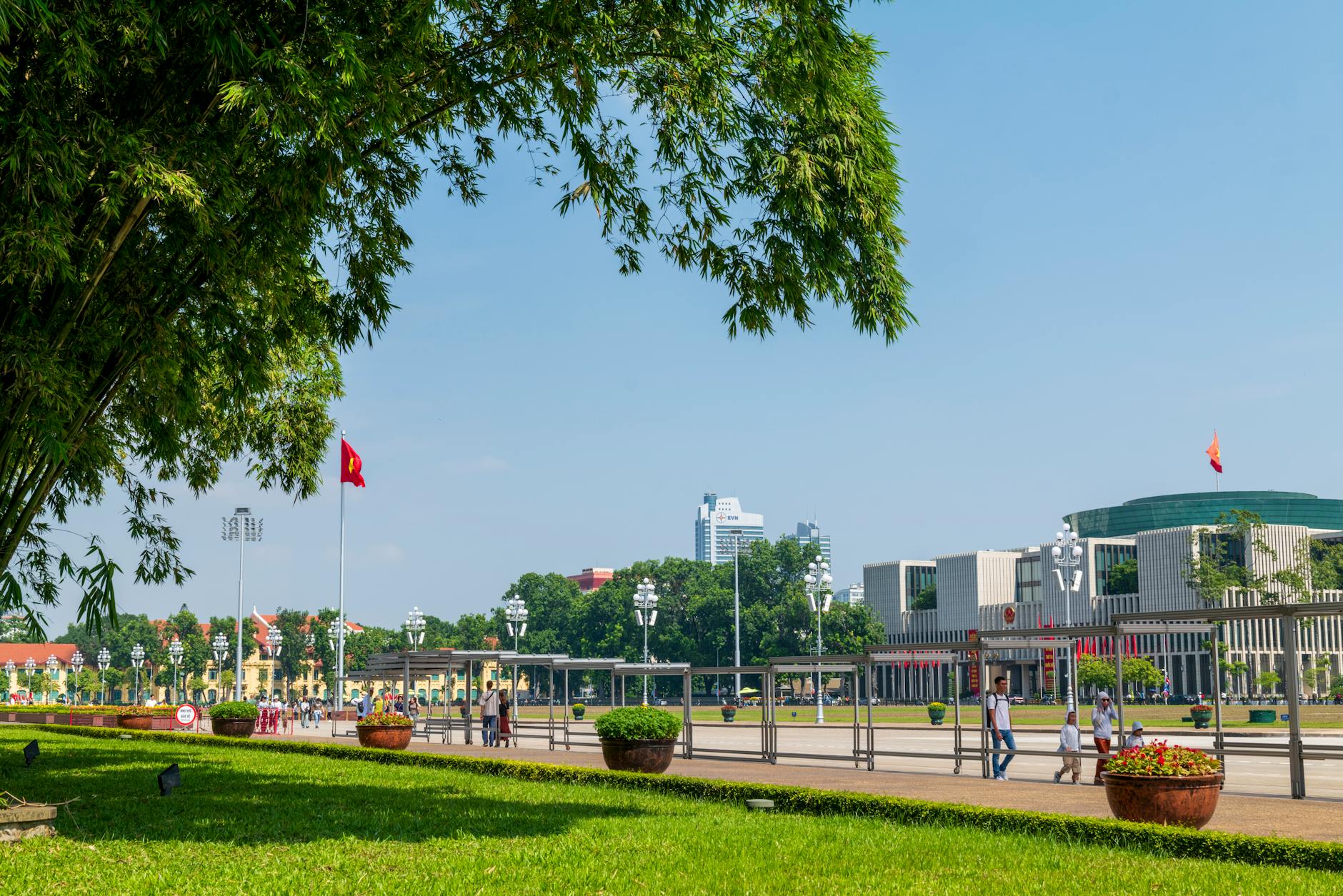 People enjoying a sunny day at Ba Dinh Square in Hanoi, Vietnam.
