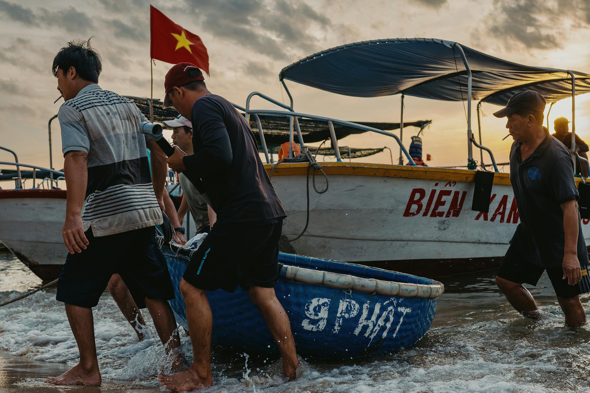 Fishermen prepare boats at sunrise in Quy Nhon, showcasing vibrant Vietnamese culture.