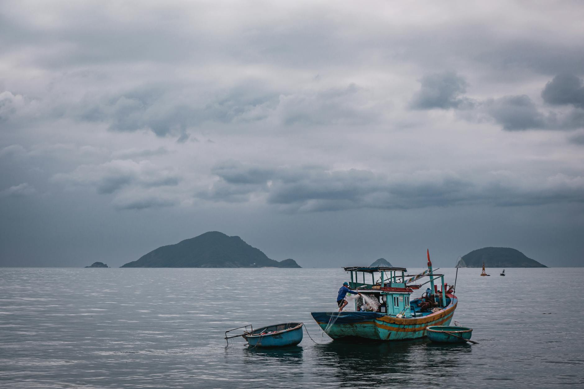 Peaceful seascape with fishing boats and islands in Ba Ria - Vung Tau, Vietnam.