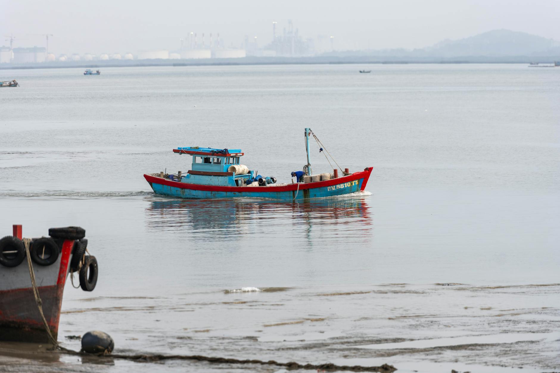 Vibrant fishing boat on calm waters in Vũng Tàu, capturing serene maritime life.