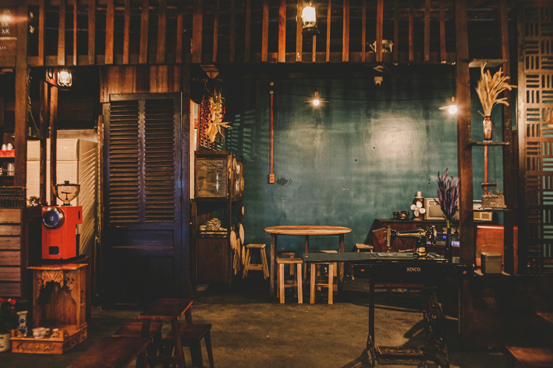 Warm and inviting rustic coffee shop interior featuring wooden furniture and vintage elements.
