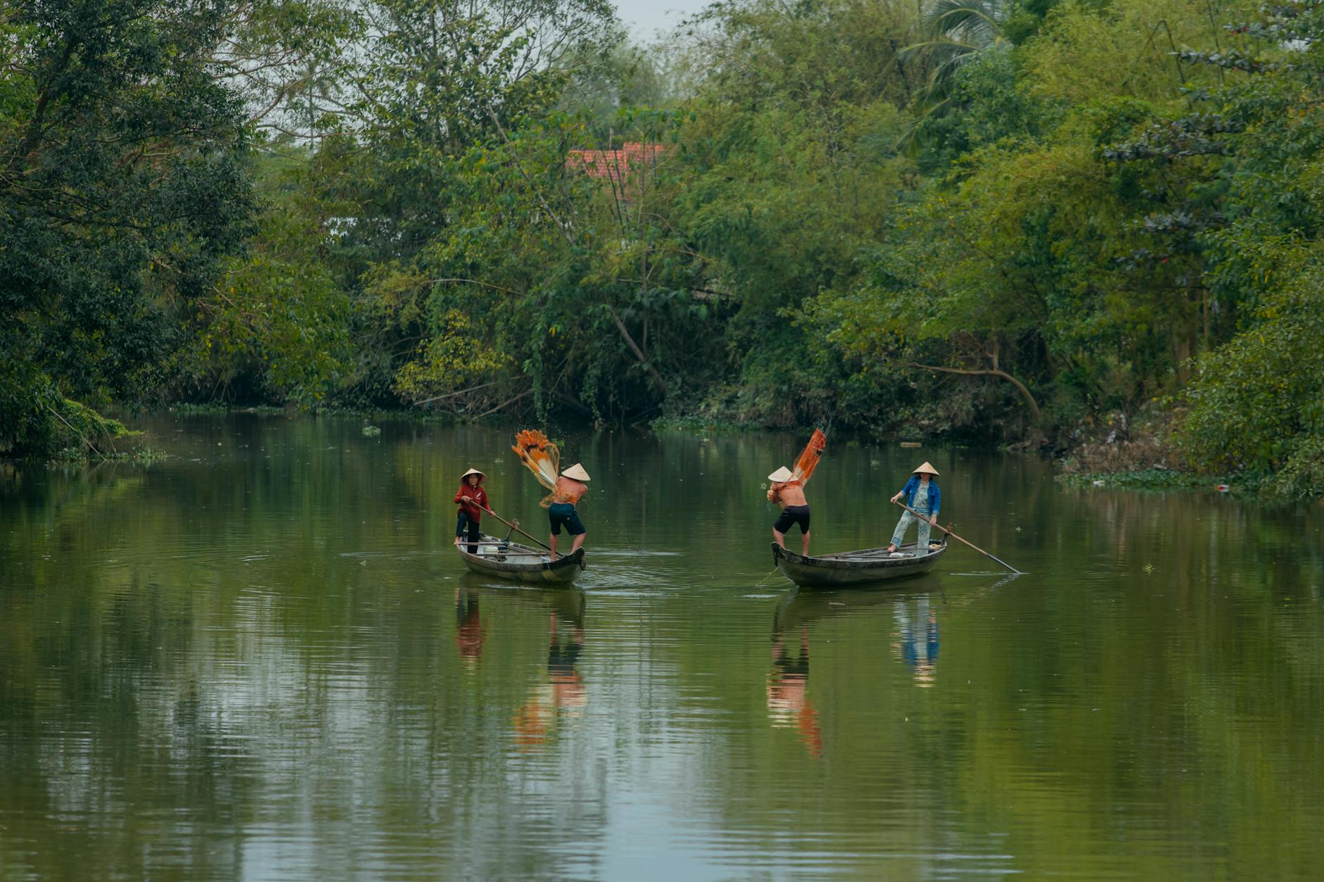 Serene scene of traditional Vietnamese boats on the Huong River.
