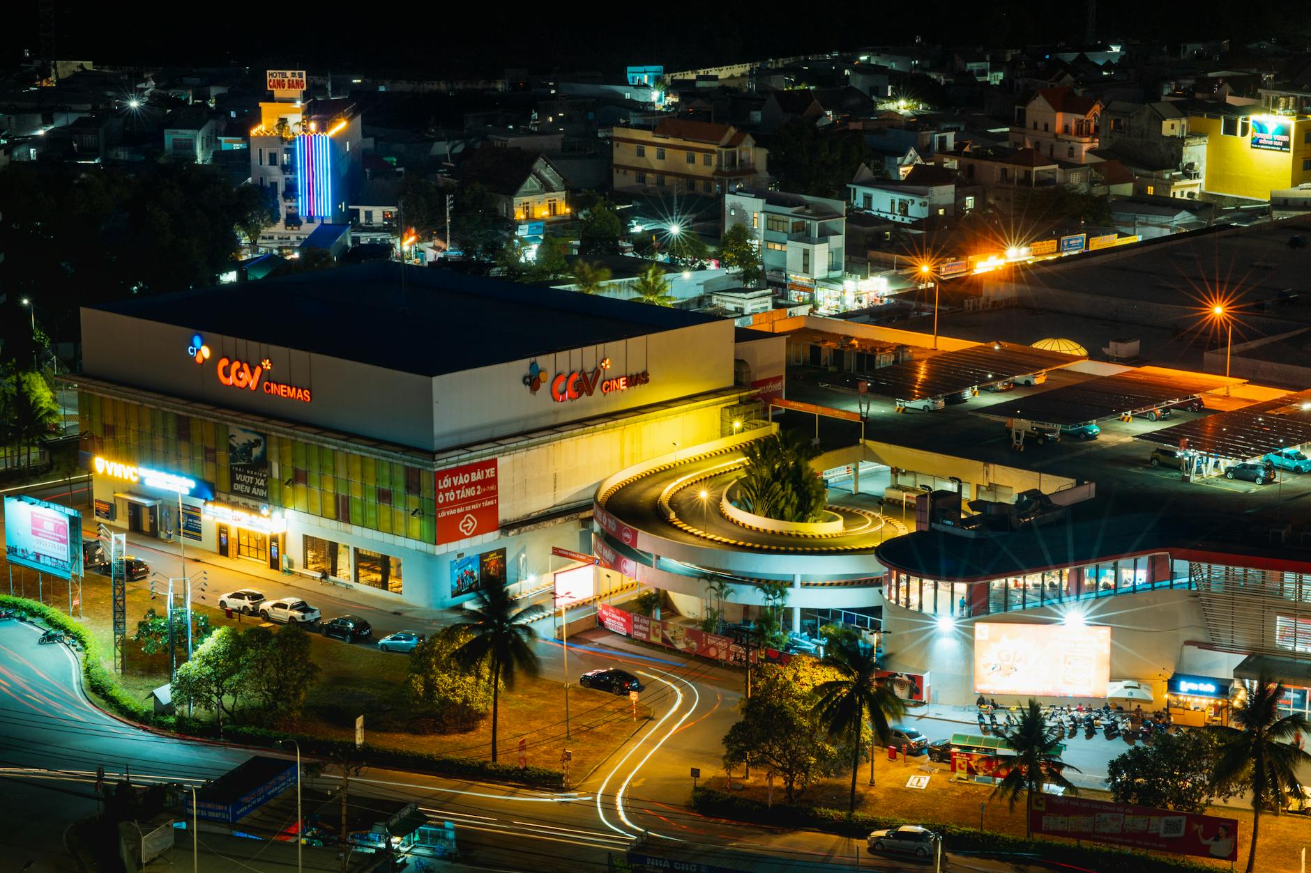 Aerial night view showcasing CGV Cinemas in Bien Hoa, Vietnam, with lively street activity.