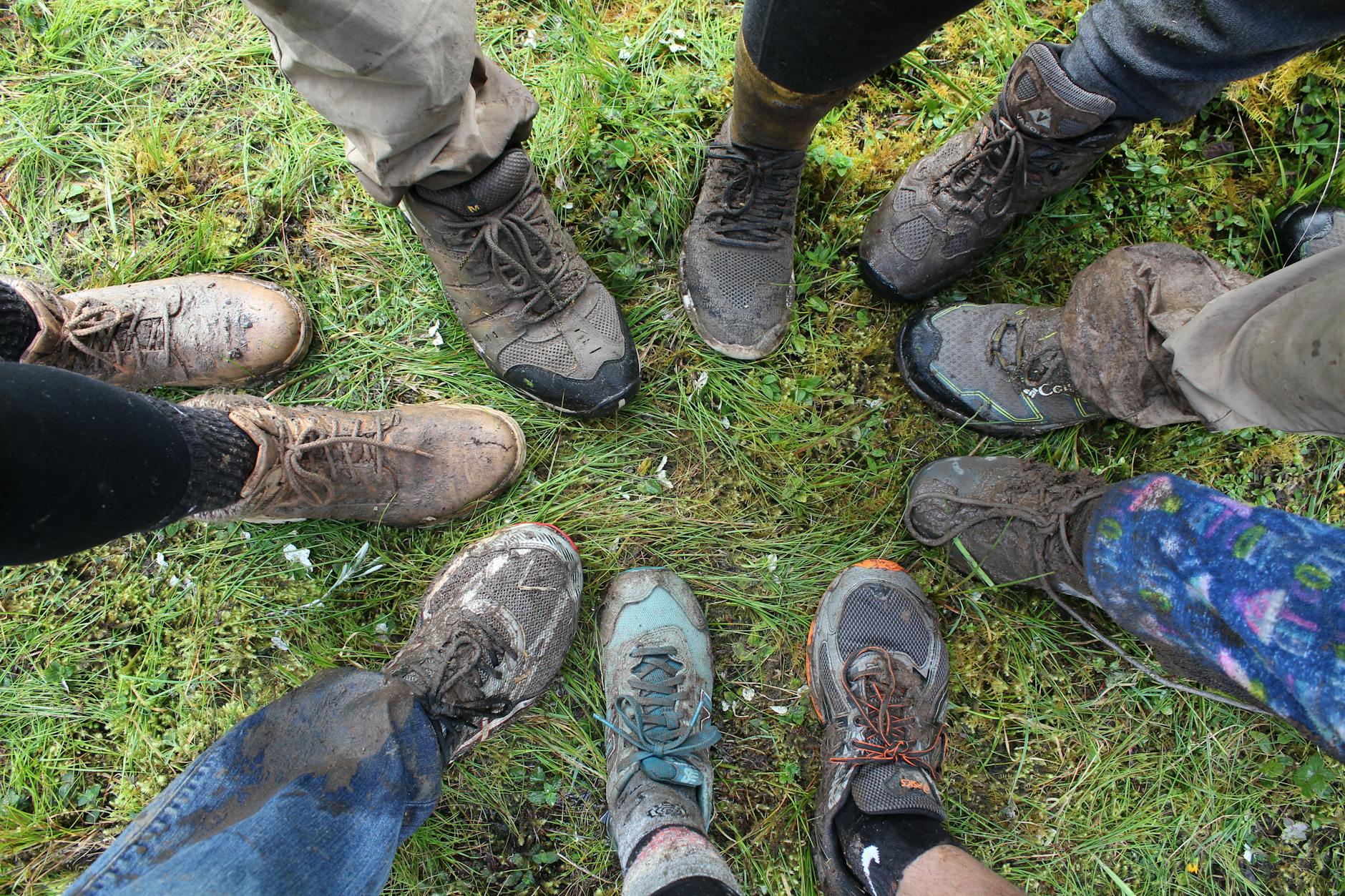 Mud-covered hiking boots in Ayabaca, Peru capture the spirit of a rugged outdoor adventure.