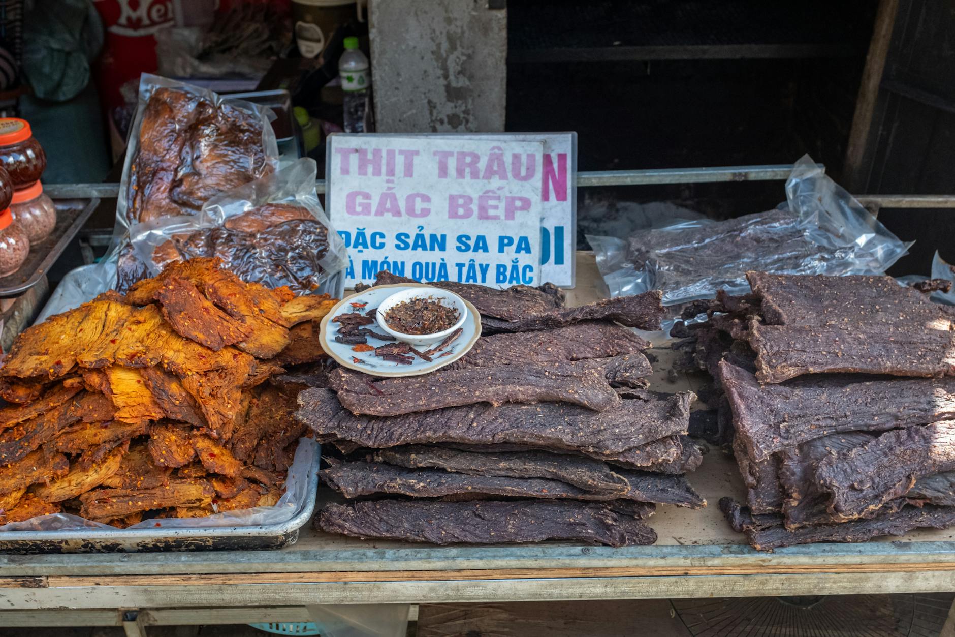 Dried buffalo meat showcased at a market stall in Sa Pa, Vietnam, highlighting traditional local delicacies.