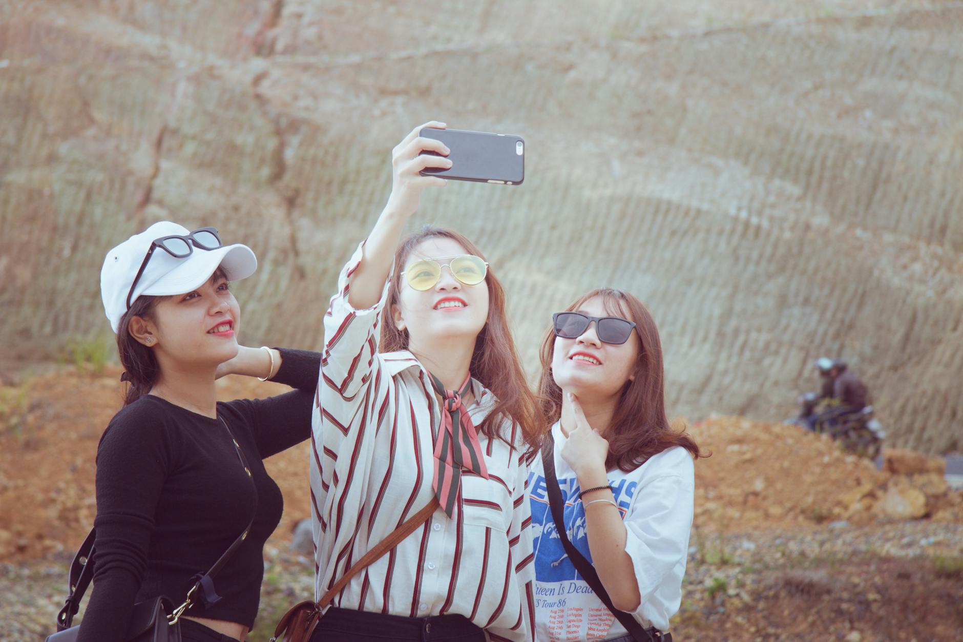 Three young women taking a selfie together in sunny Da Lat, Vietnam.