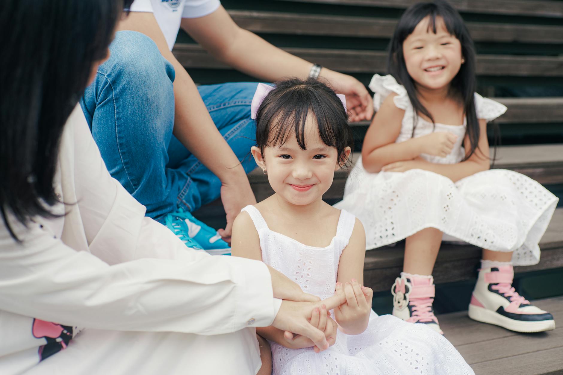 Adorable family photo capturing joyful children in a candid moment.